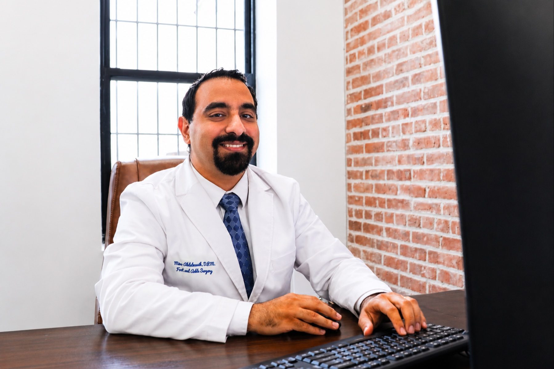 Dr. Mino Abdelmessih in a Mobile Podiatry exam office