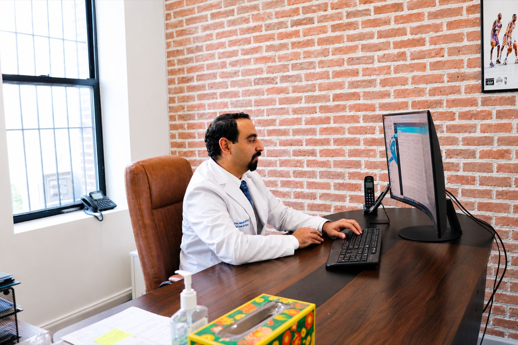 Dr. Mino Abdelmessih working at the Pitkin Avenue office